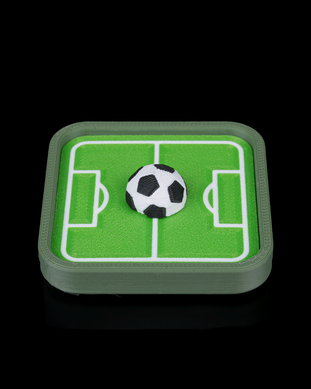 Mini Pitch Fidget — 3D printed soccer gift, shown in use